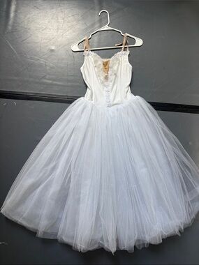 White ballet costume with tulle skirt
